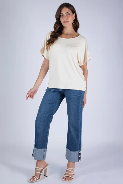 JEANS CROPPED CON BOTTONI...